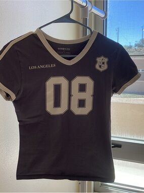 Lucky Brand Black V‑Neck Tee with Cream Trim and '08 Graphic